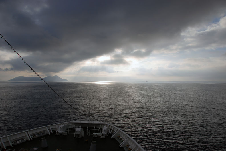 dark clouds ahead of the boat